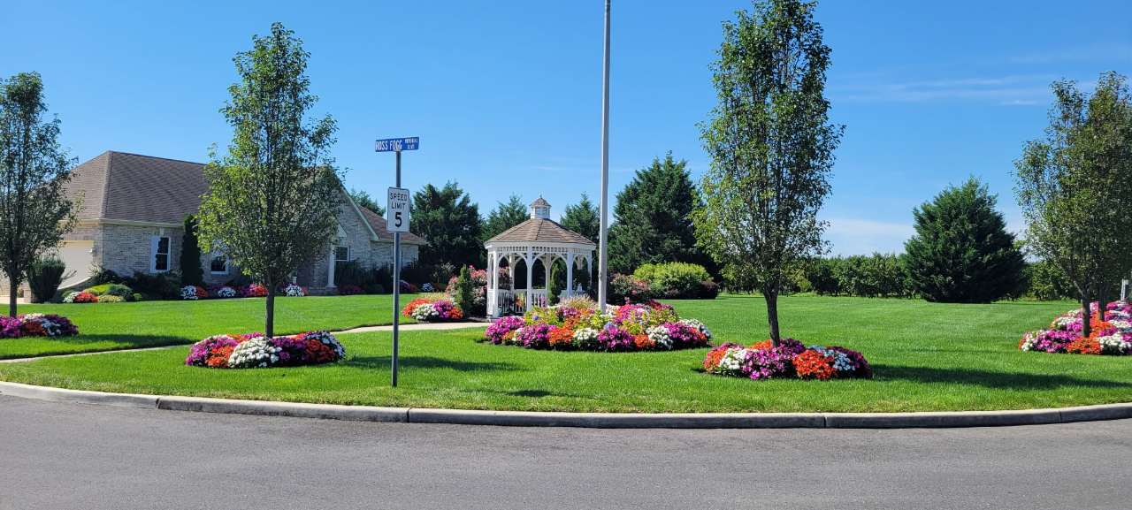 Gazebo and flower islands at a community entrance
